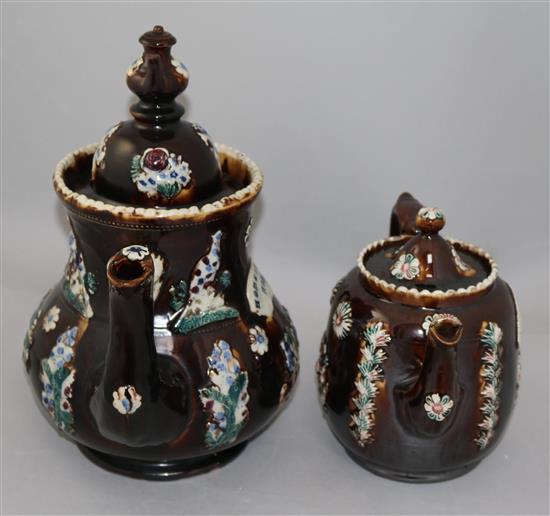 Two Meescham pottery teapots and covers, 32.5cm and 20cm